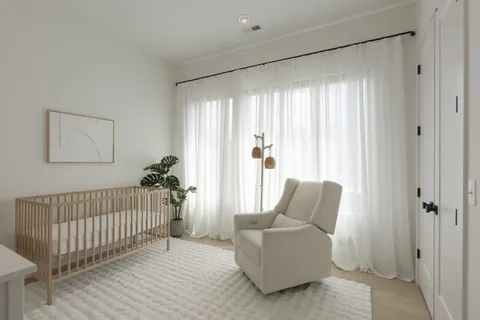 a view of a kitchen with a sink and a washer dryer