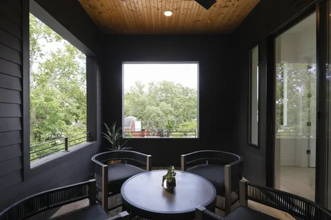 a swimming pool with outdoor seating and yard