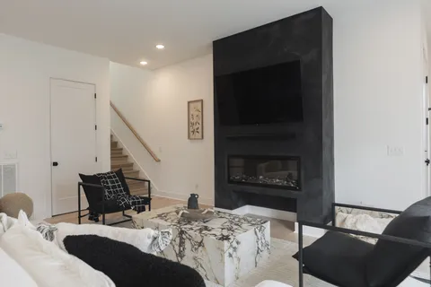 a bedroom with a bed and a fireplace