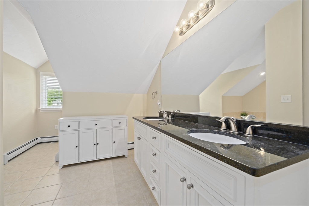 14 Sugar Maple Circle, Unit 14 Hanover, MA 02339 - Photo 26 of 38 a bathroom with a granite countertop sink and a mirror