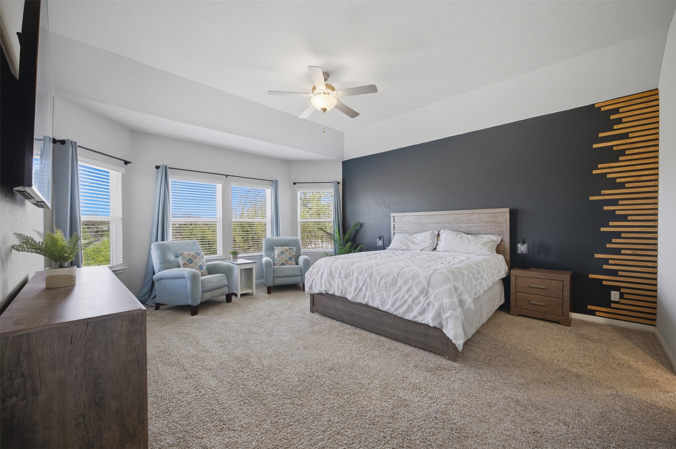 904 View Drive Georgetown, TX 78628 - Photo 12 of 40 a spacious bedroom with a bed and a couch