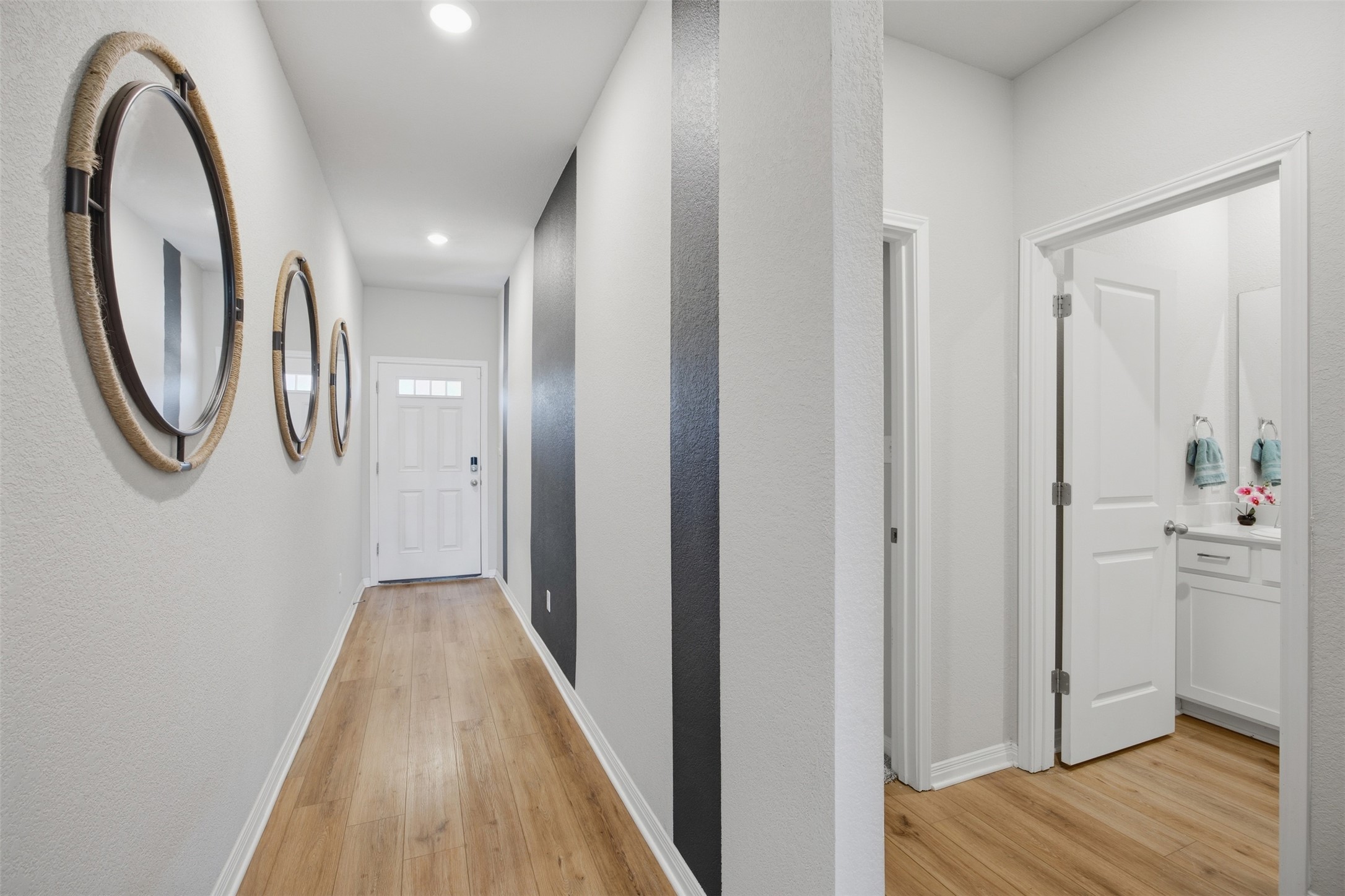 904 View Drive Georgetown, TX 78628 - Photo 17 of 40 a view of a hallway with wooden floor