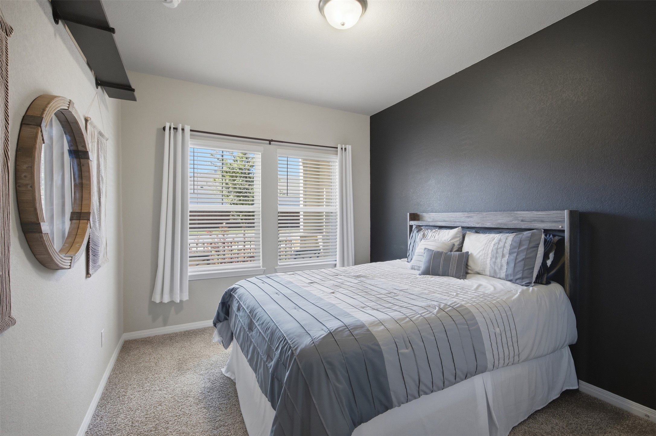 904 View Drive Georgetown, TX 78628 - Photo 18 of 40 a bed sitting in a bedroom next to a window