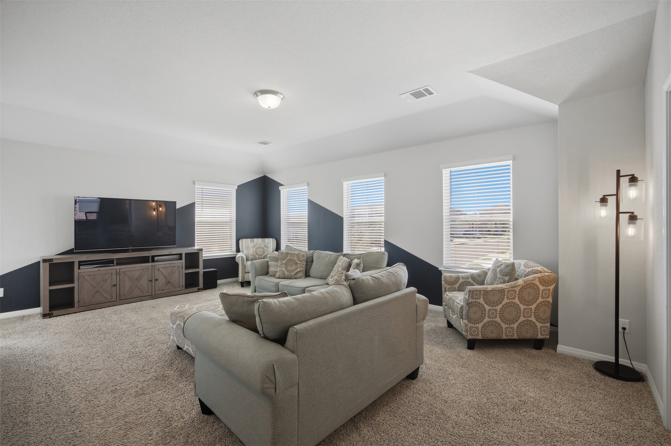 904 View Drive Georgetown, TX 78628 - Photo 23 of 40 a living room with furniture and a flat screen tv