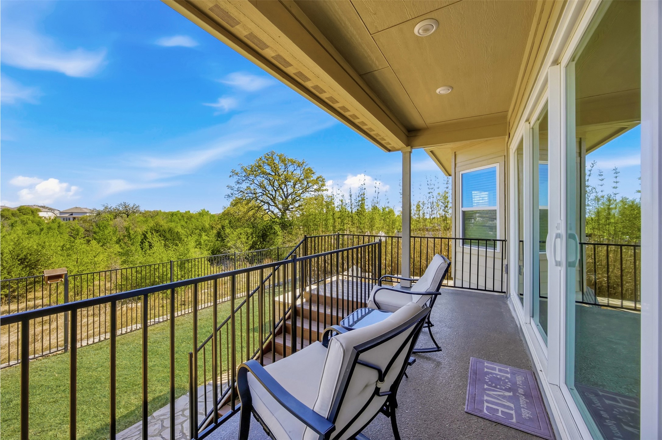 904 View Drive Georgetown, TX 78628 - Photo 31 of 40 a view of a balcony with couches and wooden floor