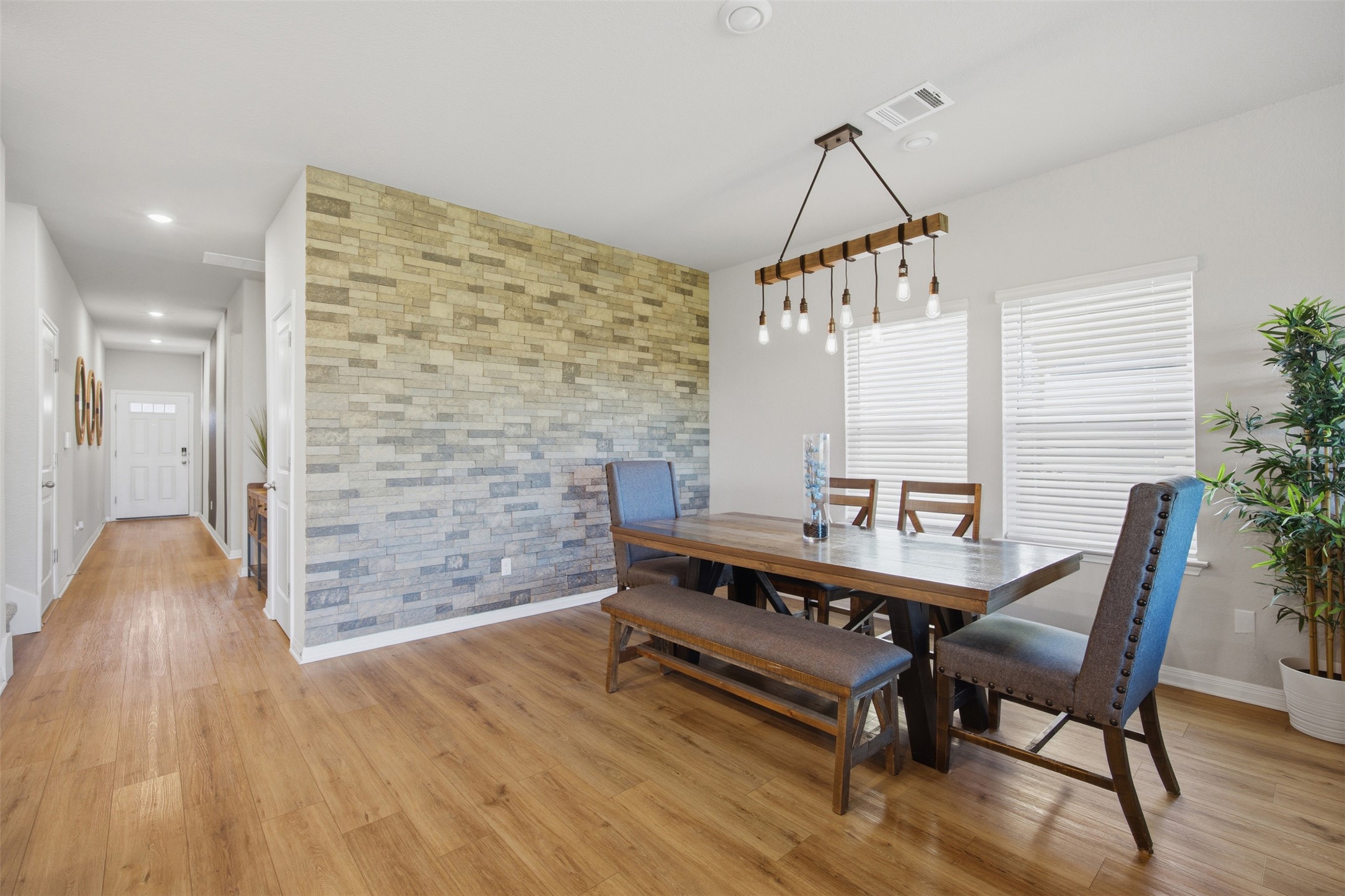 904 View Drive Georgetown, TX 78628 - Photo 7 of 40 a view of a dining room with furniture and wooden floor