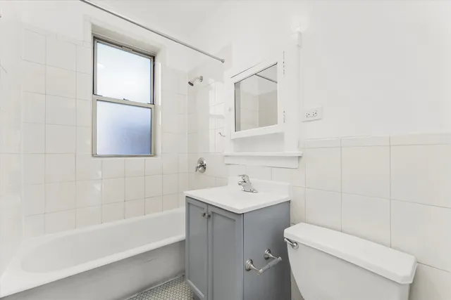 a bathroom with a sink toilet and bathtub