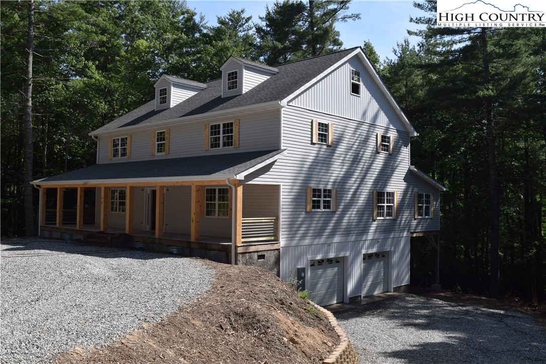 425 Mt Paron Road Deep Gap, NC 28618 - Photo 2 of 6 a front view of a house with a yard