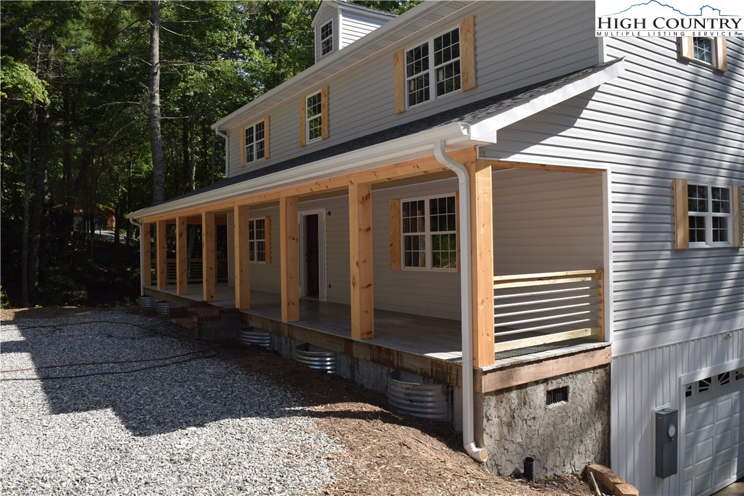 425 Mt Paron Road Deep Gap, NC 28618 - Photo 3 of 6 a view of a house with backyard and backyard