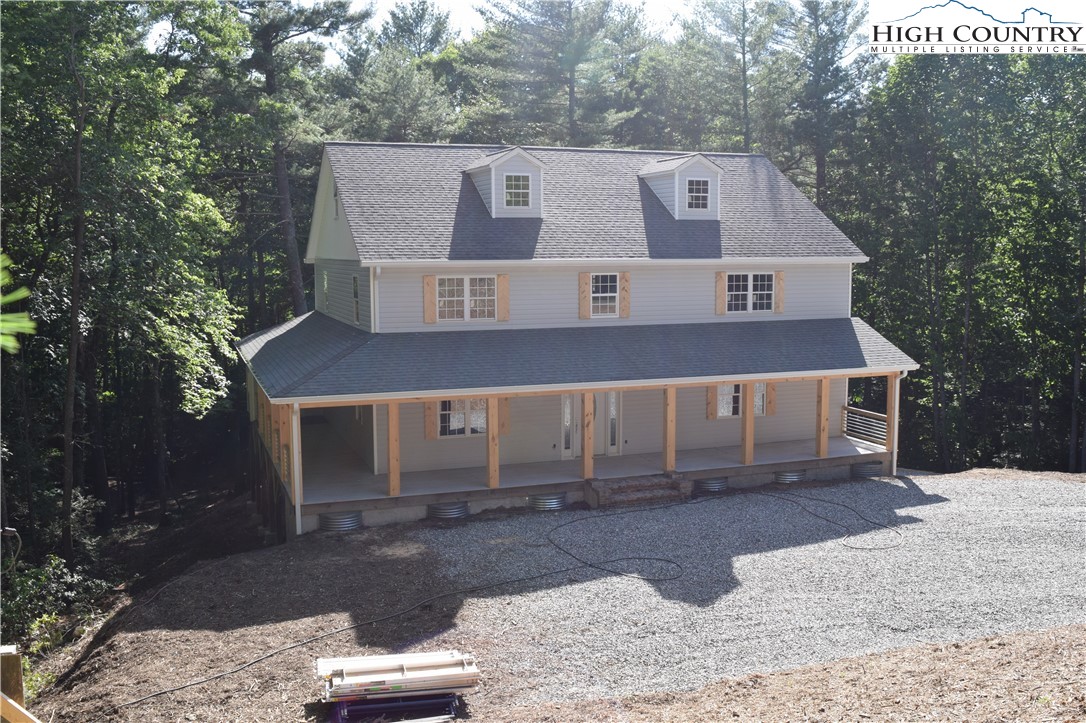 425 Mt Paron Road Deep Gap, NC 28618 - Photo 5 of 6 a front view of a house with a yard