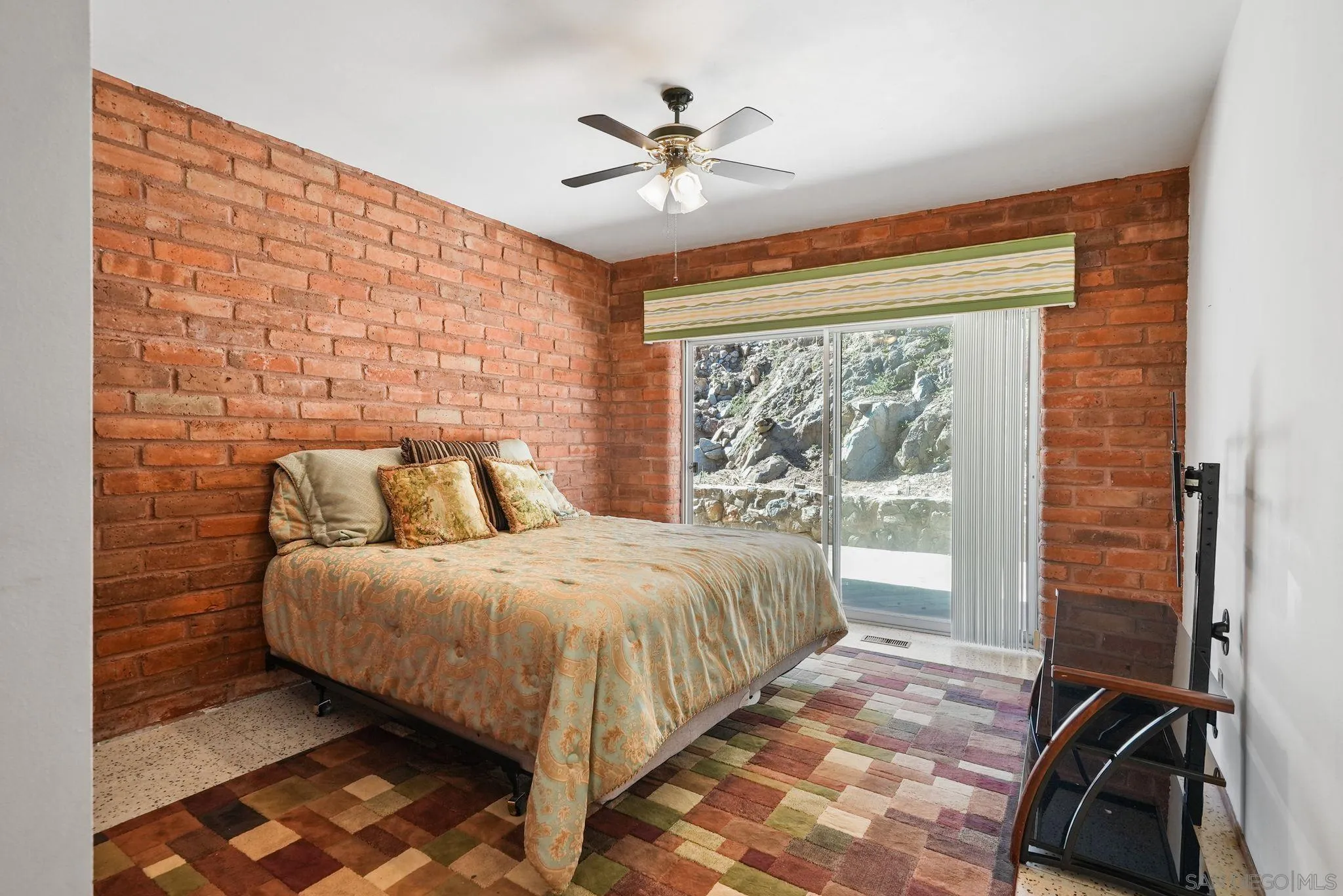 14740 Willow Road Lakeside, CA 92040 - Photo 23 of 37 a spacious bedroom with a bed and a window