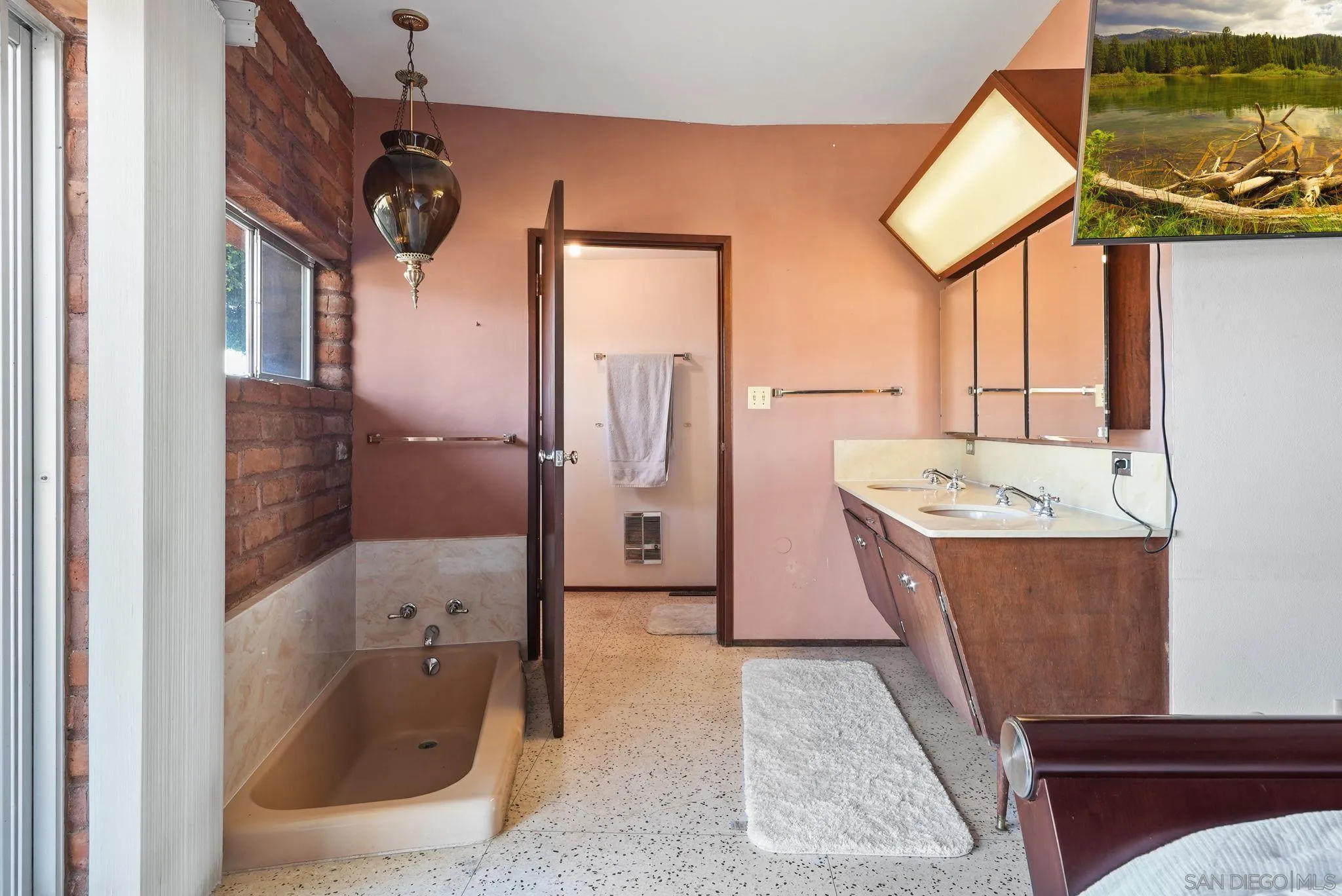 14740 Willow Road Lakeside, CA 92040 - Photo 28 of 37 a bathroom with a tub sink and mirror