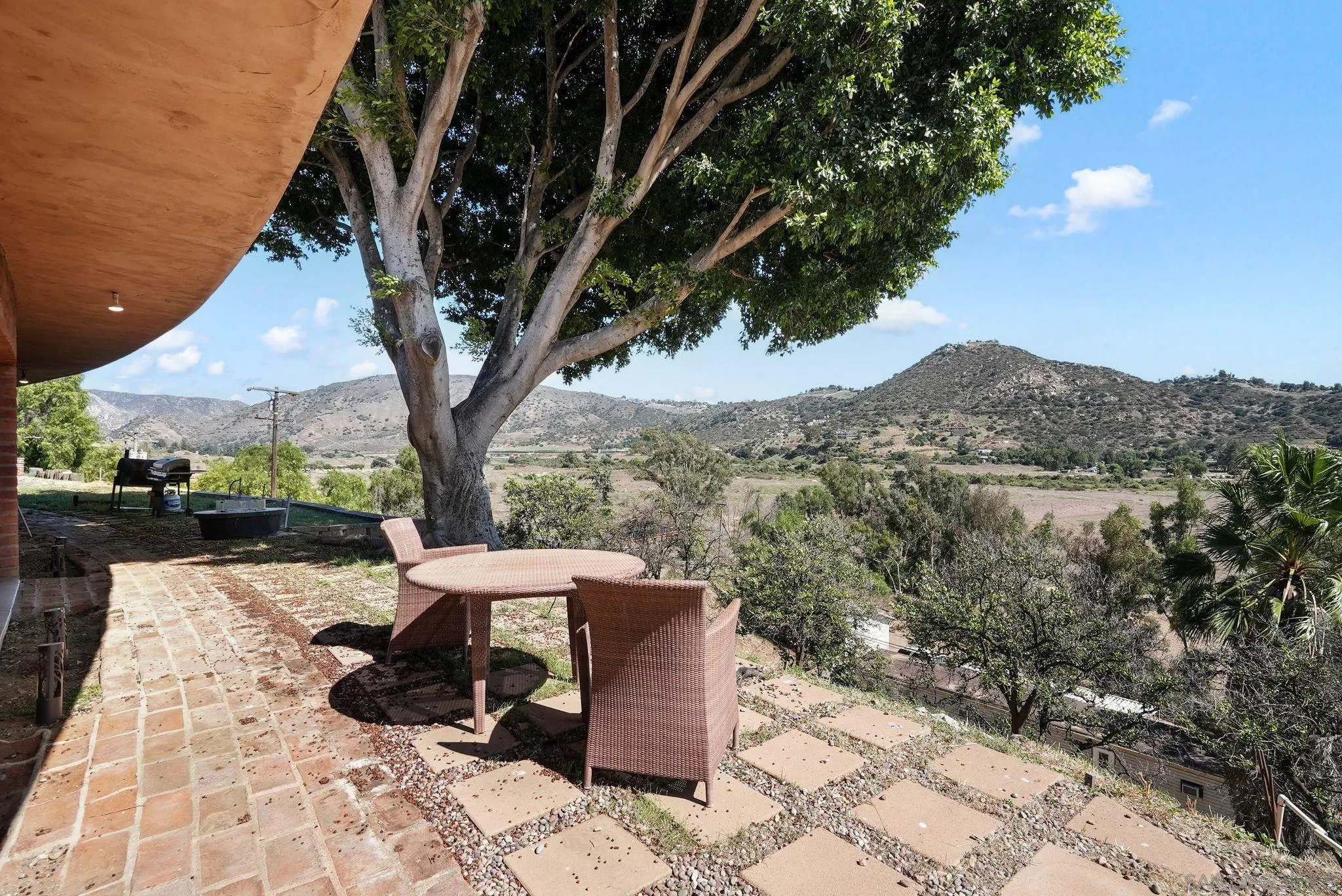 14740 Willow Road Lakeside, CA 92040 - Photo 3 of 37 a view of a terrace with a bench