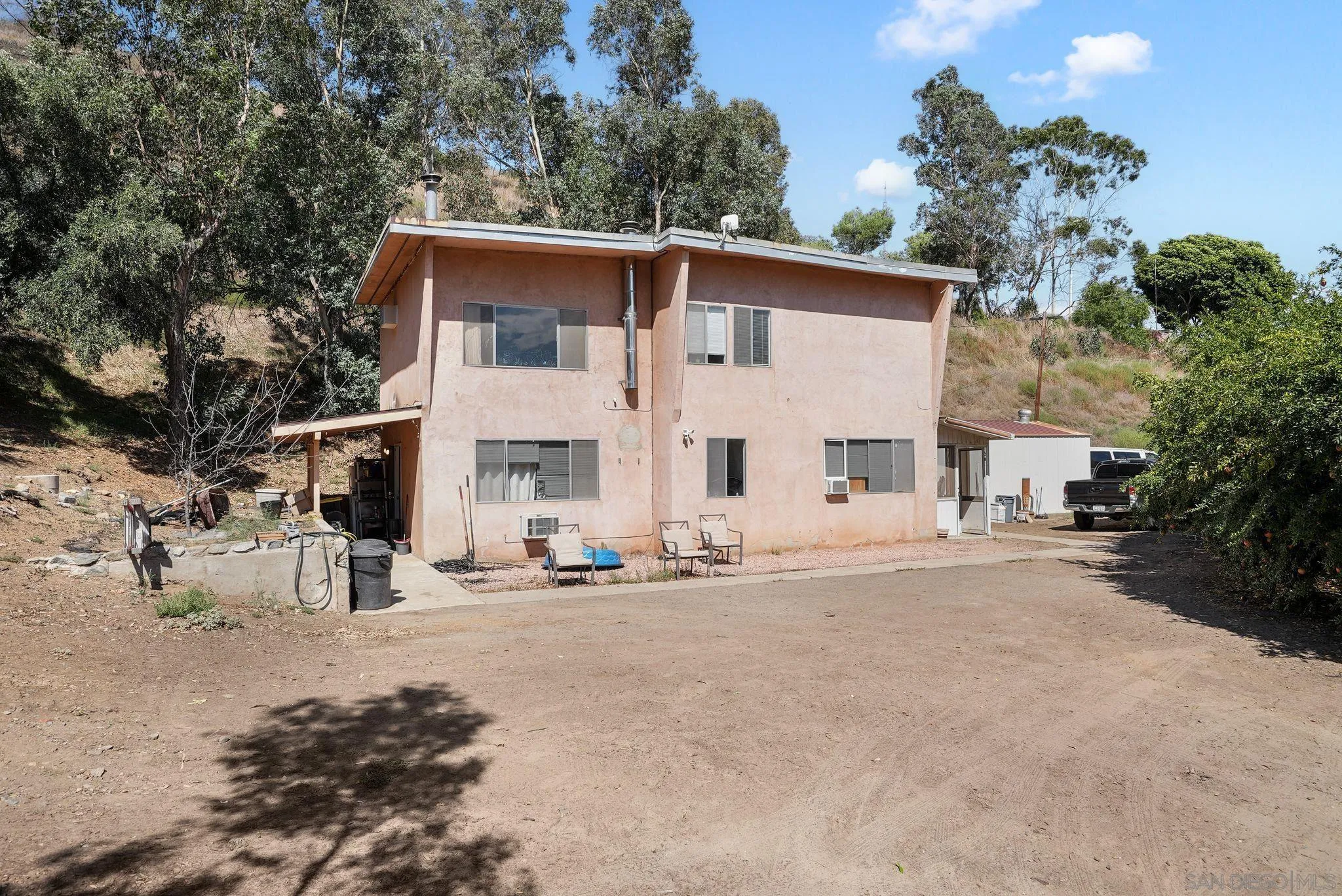 14740 Willow Road Lakeside, CA 92040 - Photo 36 of 37 a view of a white house with a outdoor space