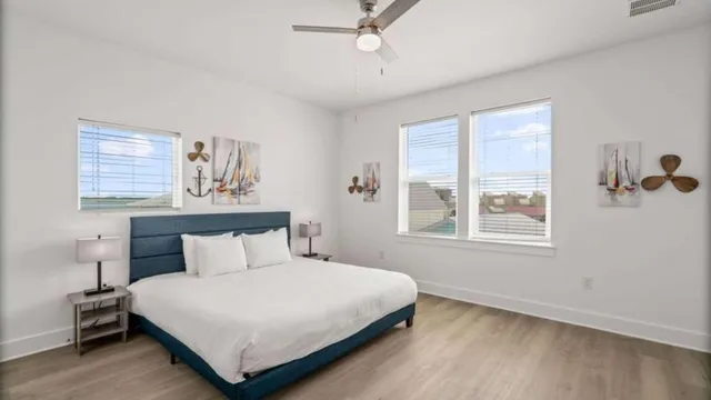 a bedroom with a bed and window