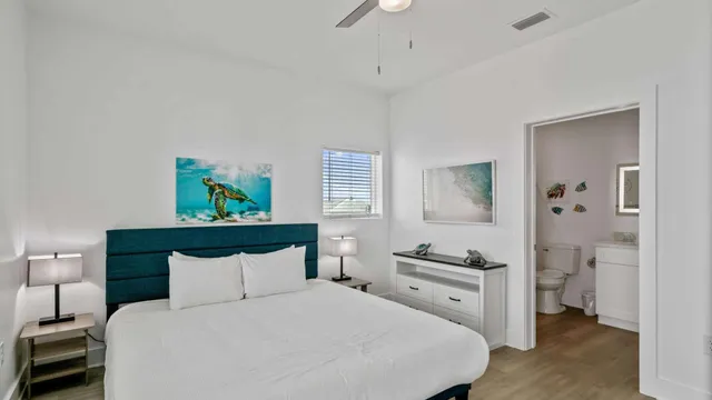 a bedroom with a bed and a view of bathroom