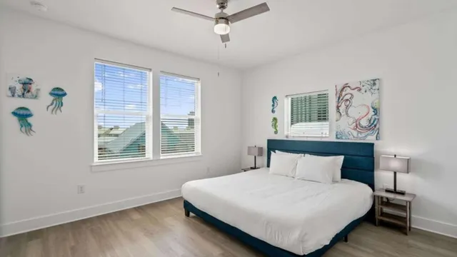 a bedroom with a bed and window