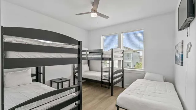 a bedroom with furniture and white walls