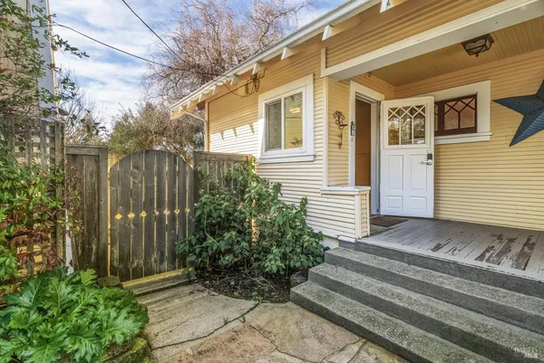 a view of a house with a backyard
