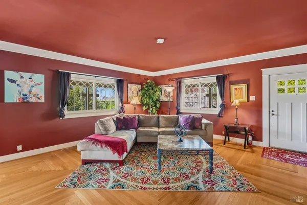 a living room with furniture and a bookshelf