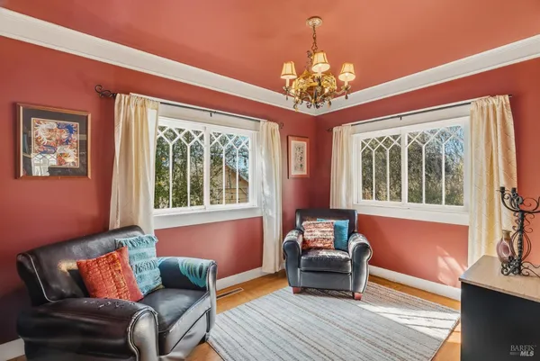 a view of a dining room with furniture window and wooden floor