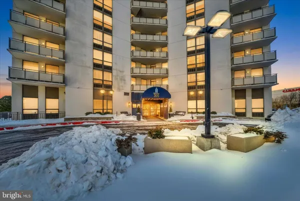 a view of a swimming pool with outdoor seating