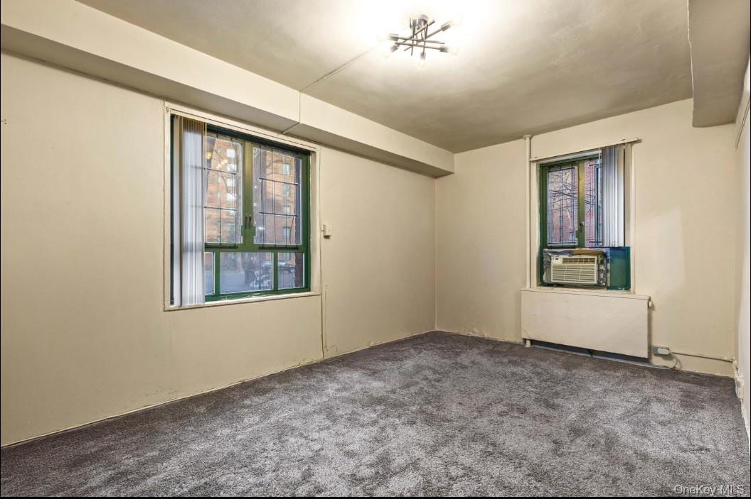 1480 Parkchester Road Bronx, NY 10462 - Photo 3 of 5 an empty room with windows