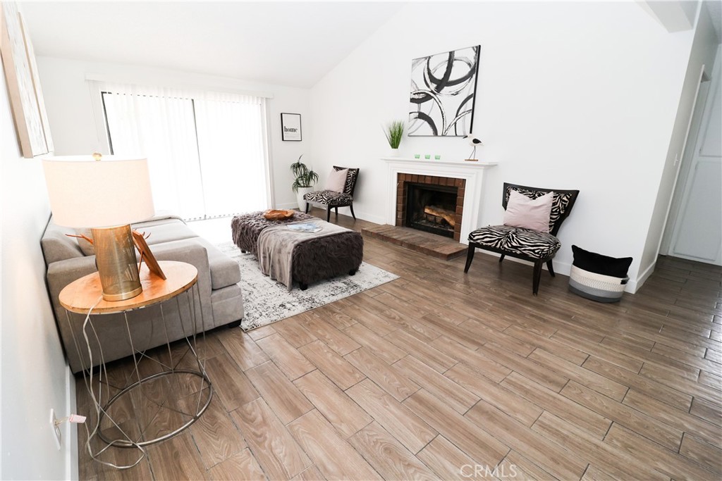 1161 Blue Ridge Lane Colton, CA 92324 - Photo 13 of 36 a living room with furniture and a fireplace