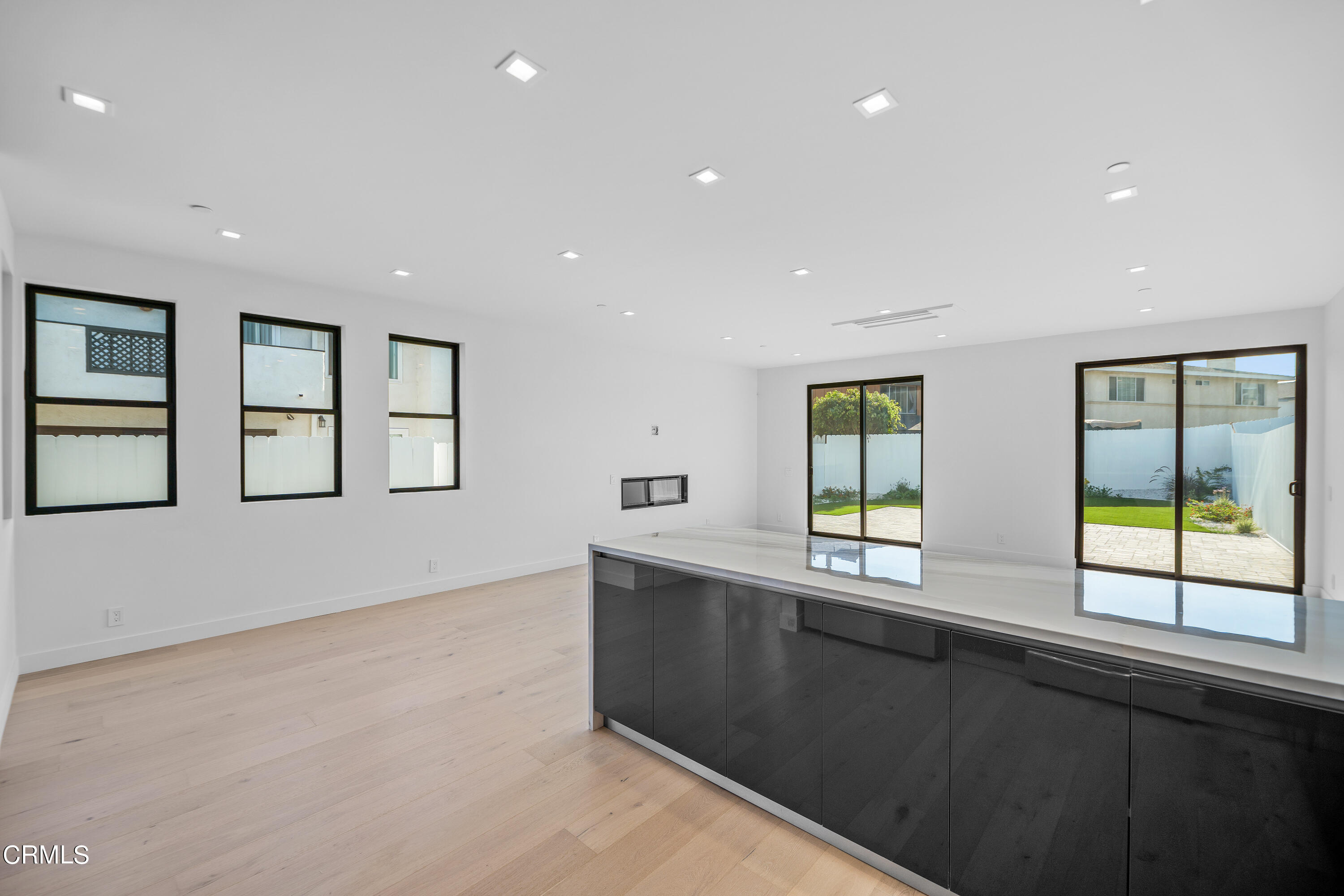 1005 Catamaran Street Oxnard, CA 93035 - Photo 15 of 35 a kitchen with windows and cabinets