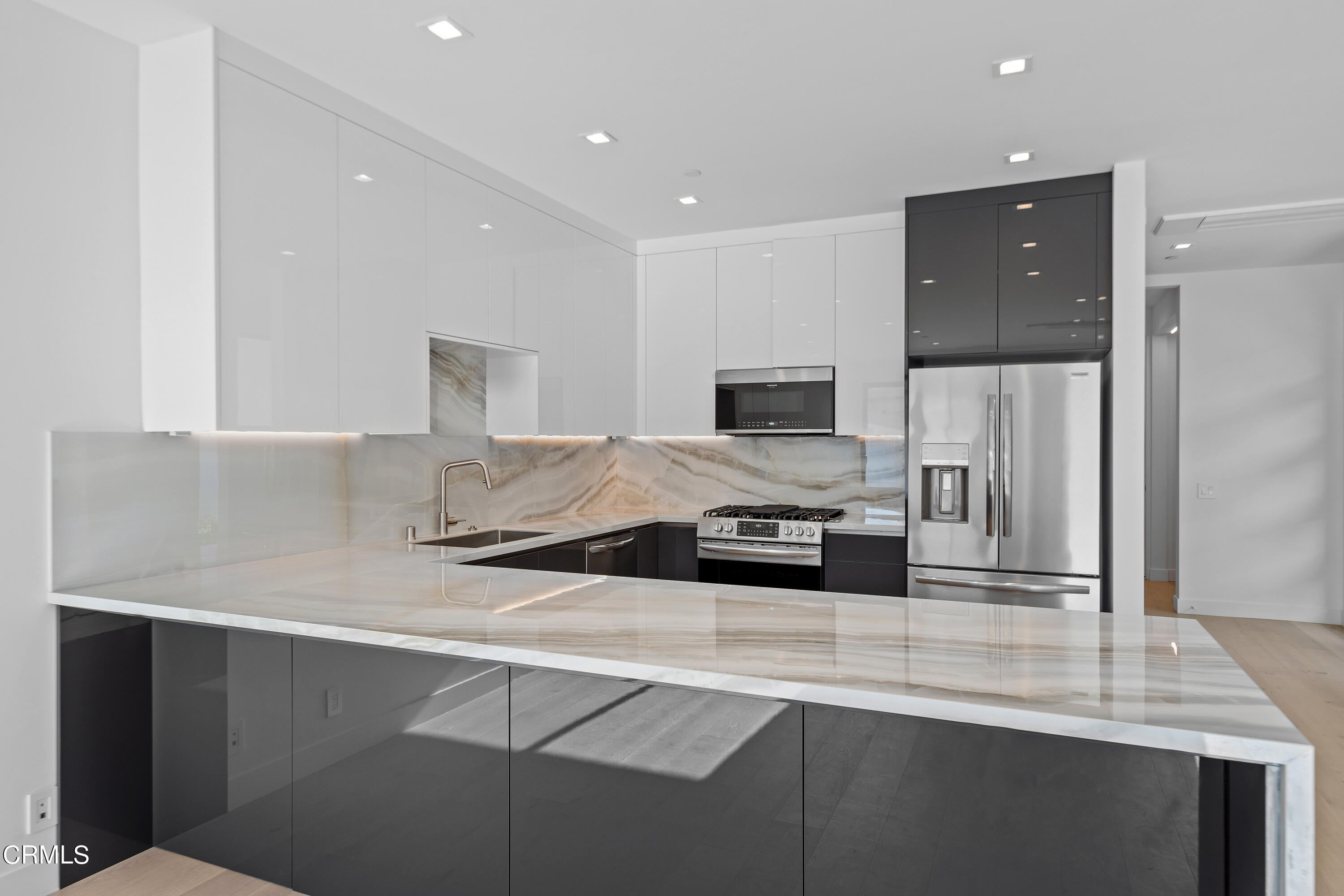 1005 Catamaran Street Oxnard, CA 93035 - Photo 17 of 35 a kitchen with stainless steel appliances a sink stove and refrigerator