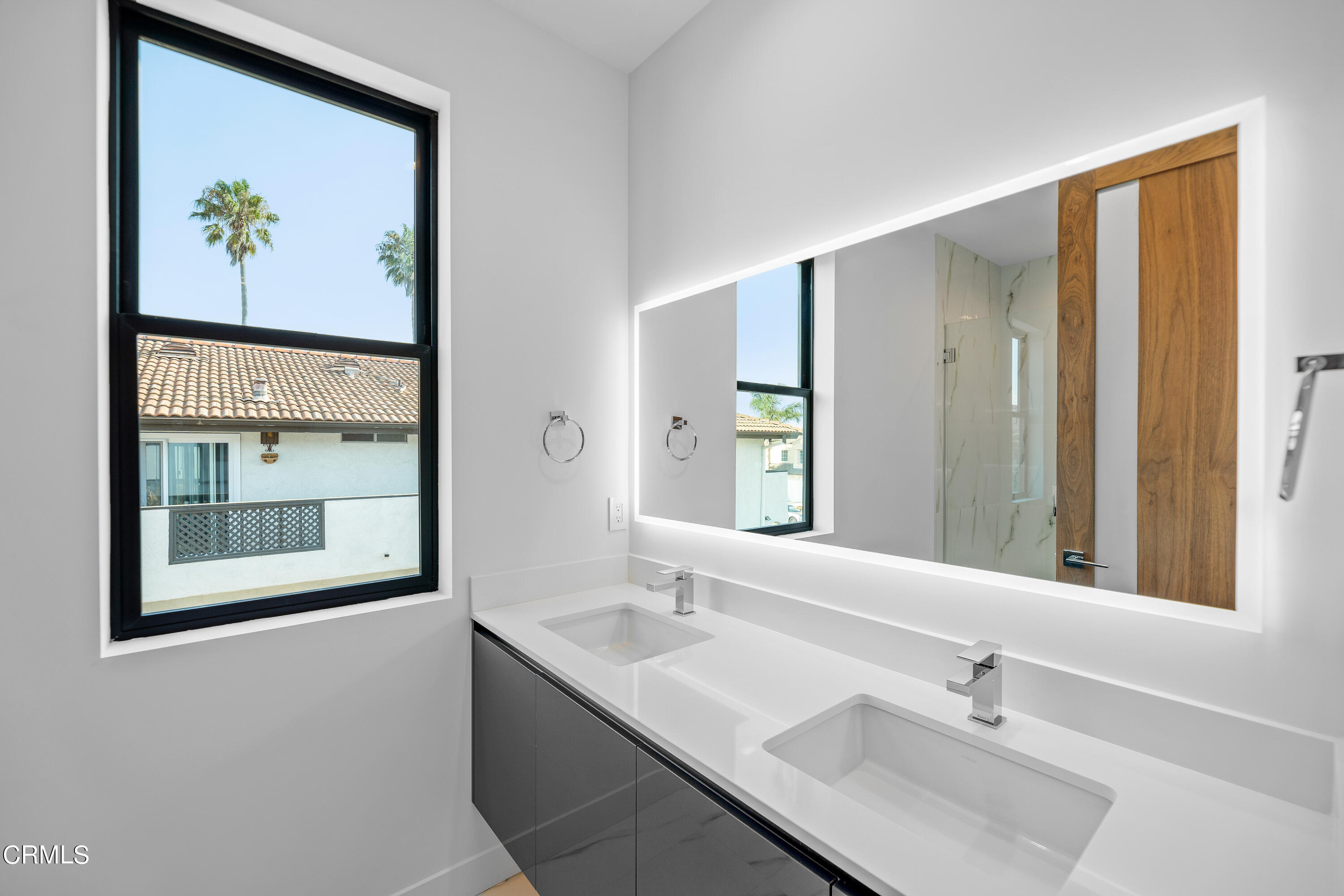 1005 Catamaran Street Oxnard, CA 93035 - Photo 27 of 35 a bathroom with a sink and a mirror