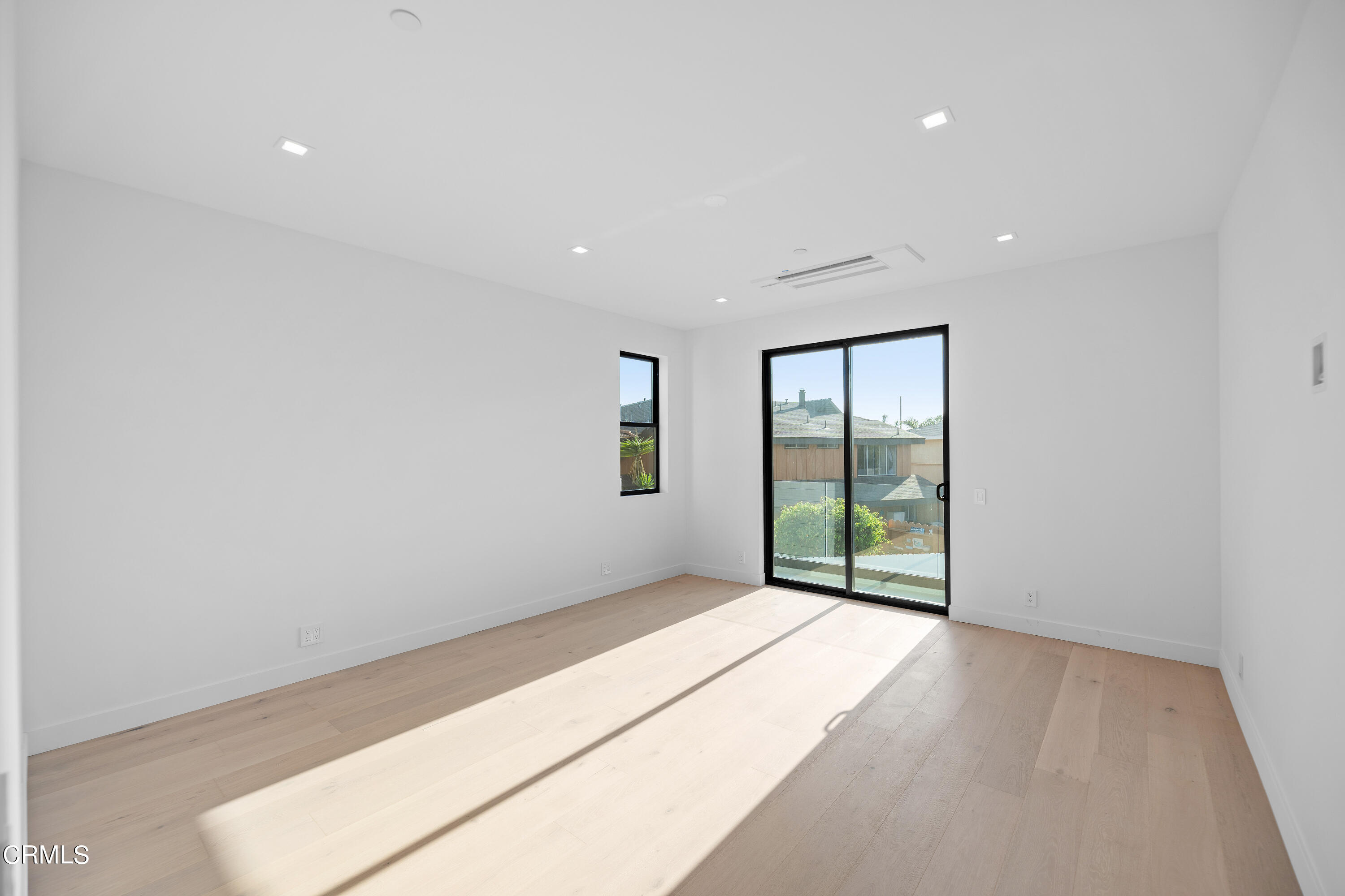 1005 Catamaran Street Oxnard, CA 93035 - Photo 29 of 35 a view of an empty room with wooden floor