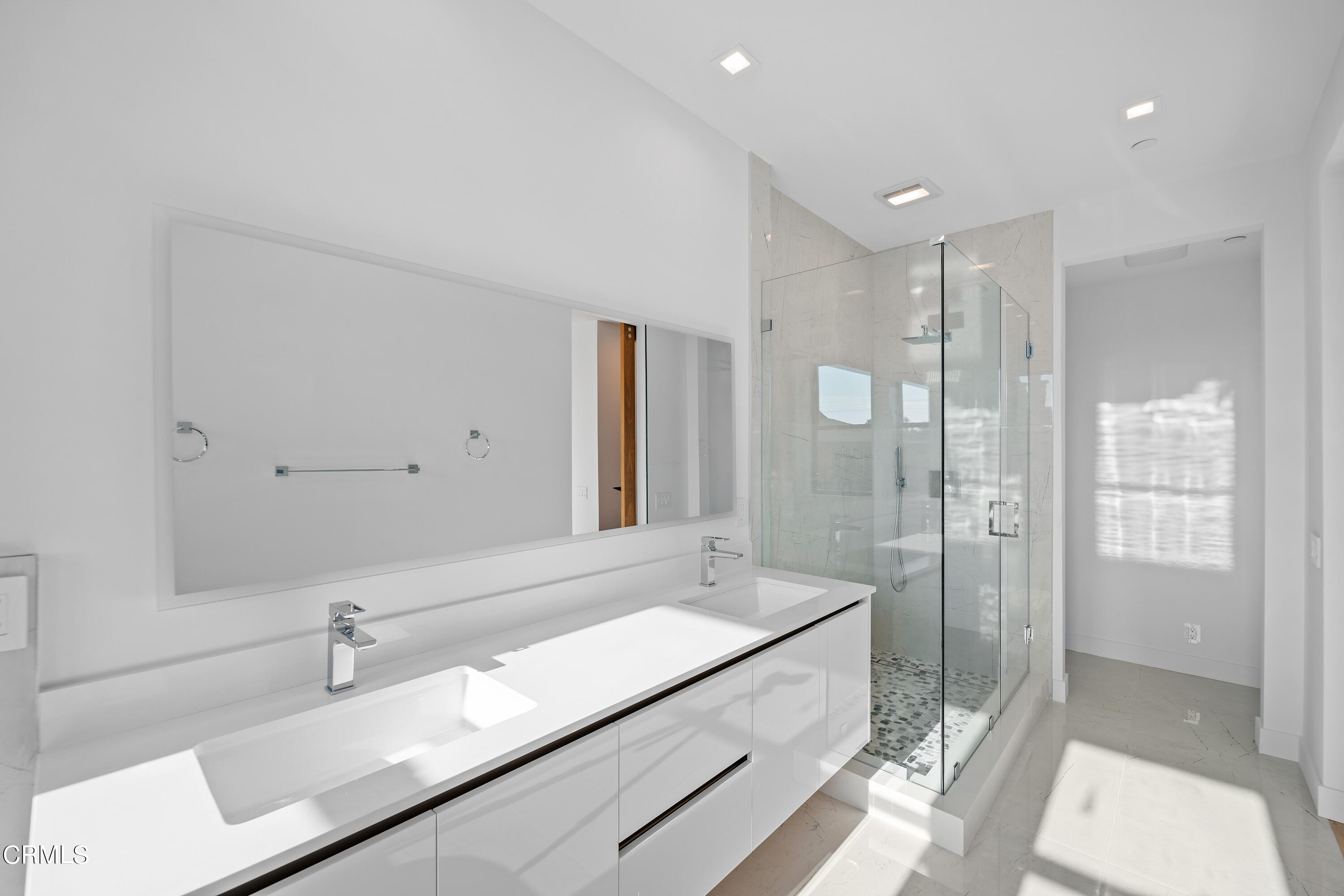 1005 Catamaran Street Oxnard, CA 93035 - Photo 32 of 35 a bathroom with a granite countertop sink a toilet and shower