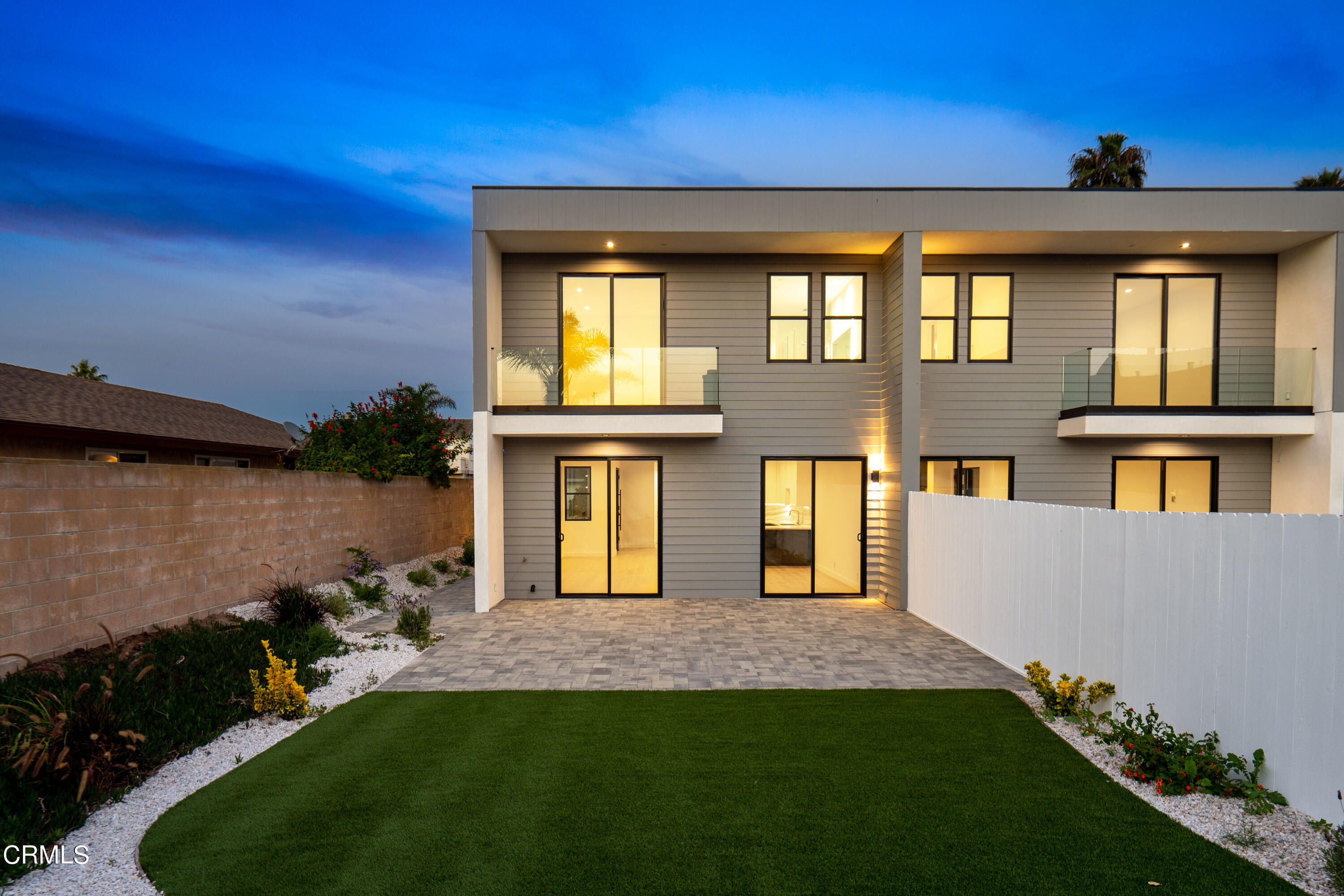1005 Catamaran Street Oxnard, CA 93035 - Photo 10 of 35 a front view of a house with a yard