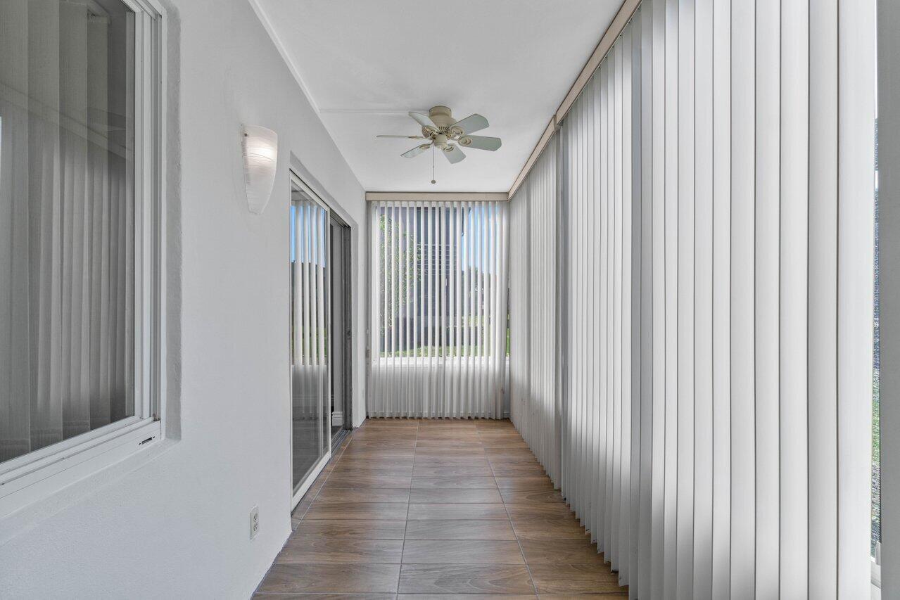 637 Normandy Lane, Unit N Delray Beach, FL 33484 - Photo 20 of 30 glass enclosed patio