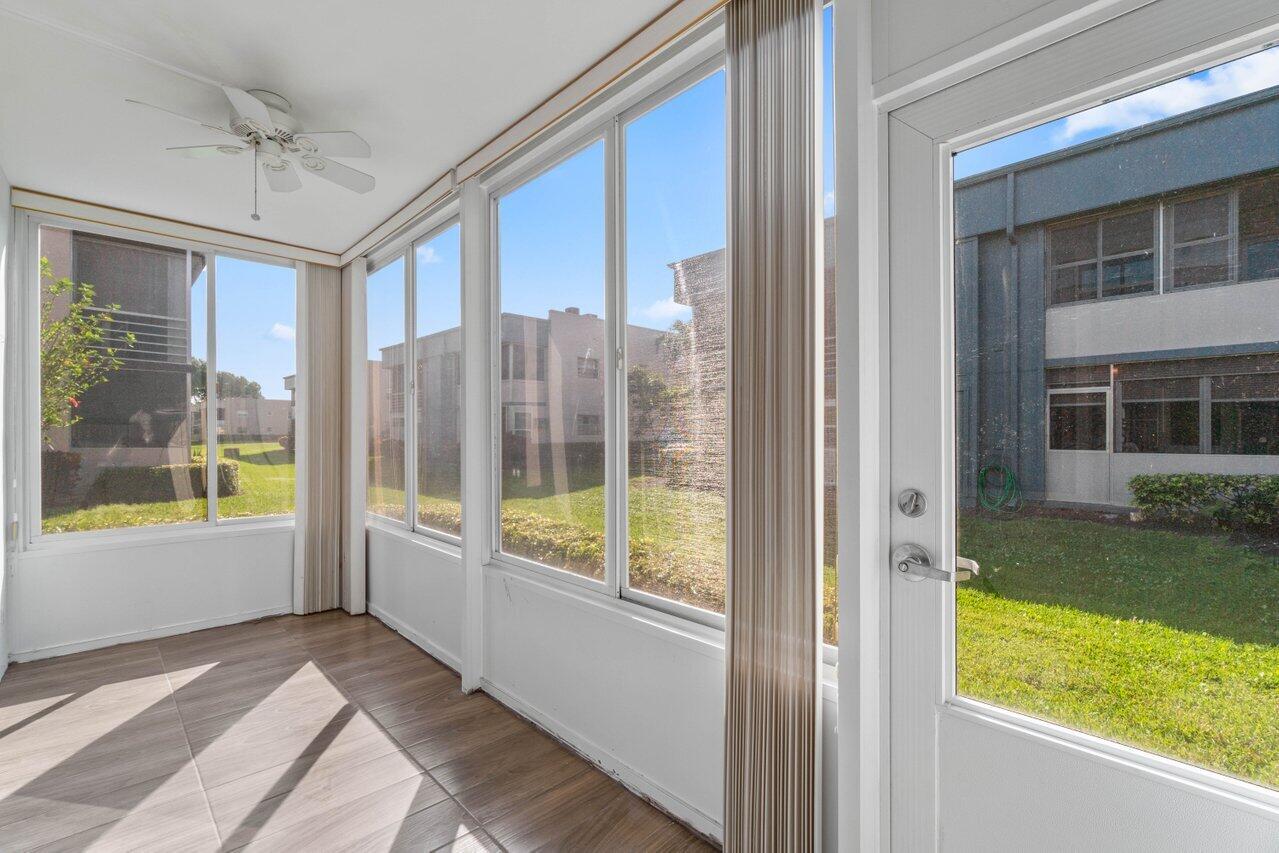 637 Normandy Lane, Unit N Delray Beach, FL 33484 - Photo 21 of 30 glass enclosed patio