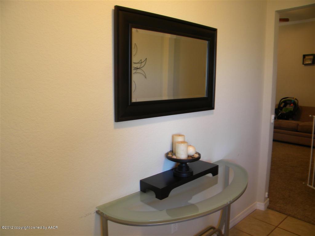 4802 Nimbus Lane Amarillo, TX 79110 - Photo 3 of 17 a room with a chair and couch