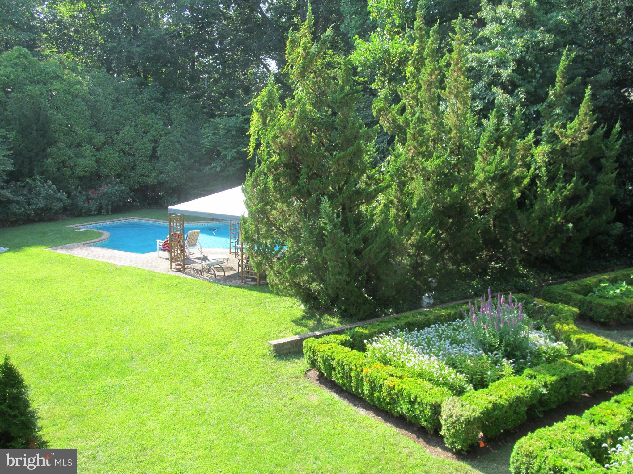 1917 Hidden Point Road Annapolis, MD 21409 - Photo 6 of 30 Side yard area with pool and English garden