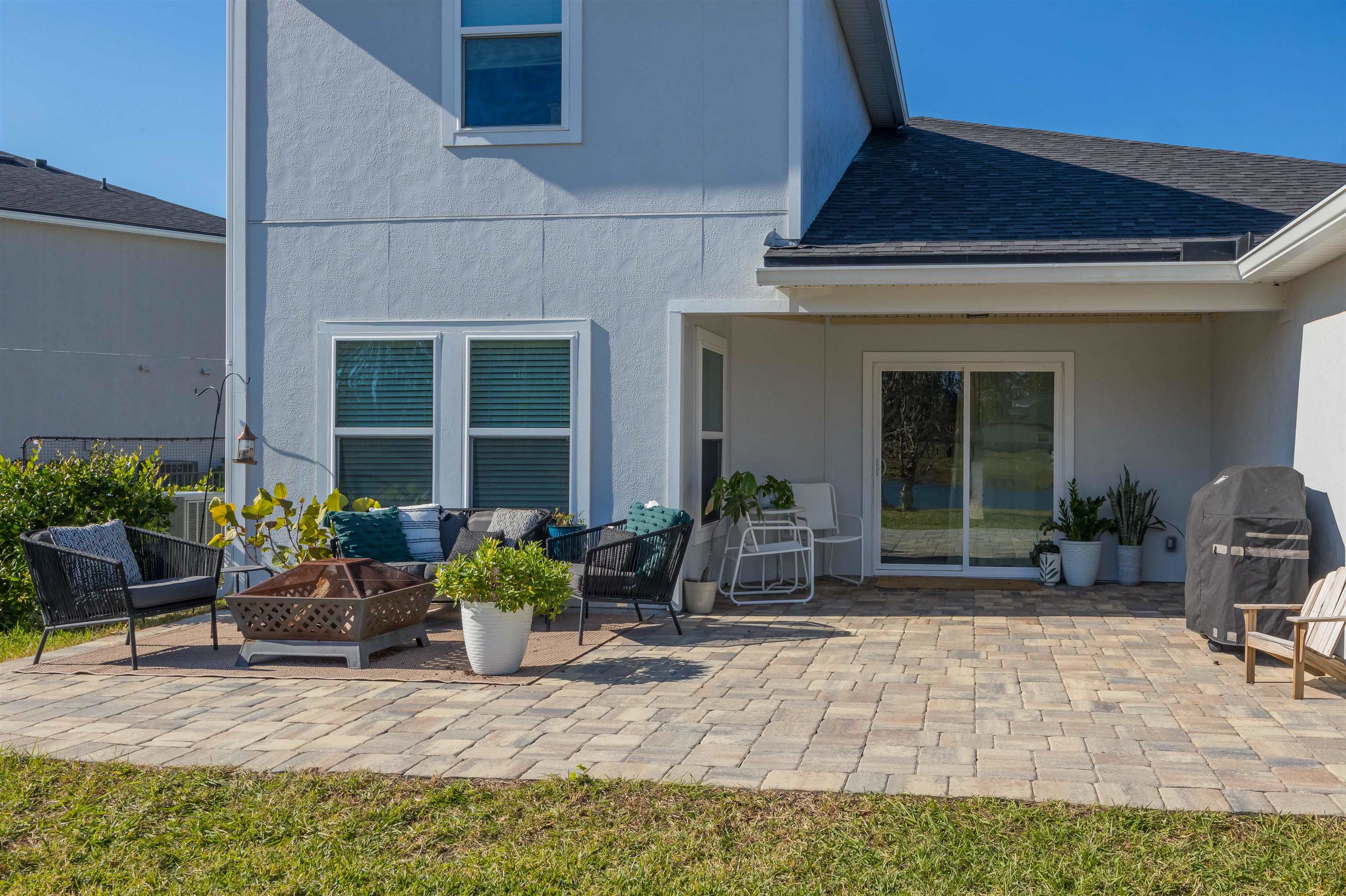 151 Birdfield Court St. Augustine, FL 32092 - Photo 28 of 73 a couple of table and chairs in front of house