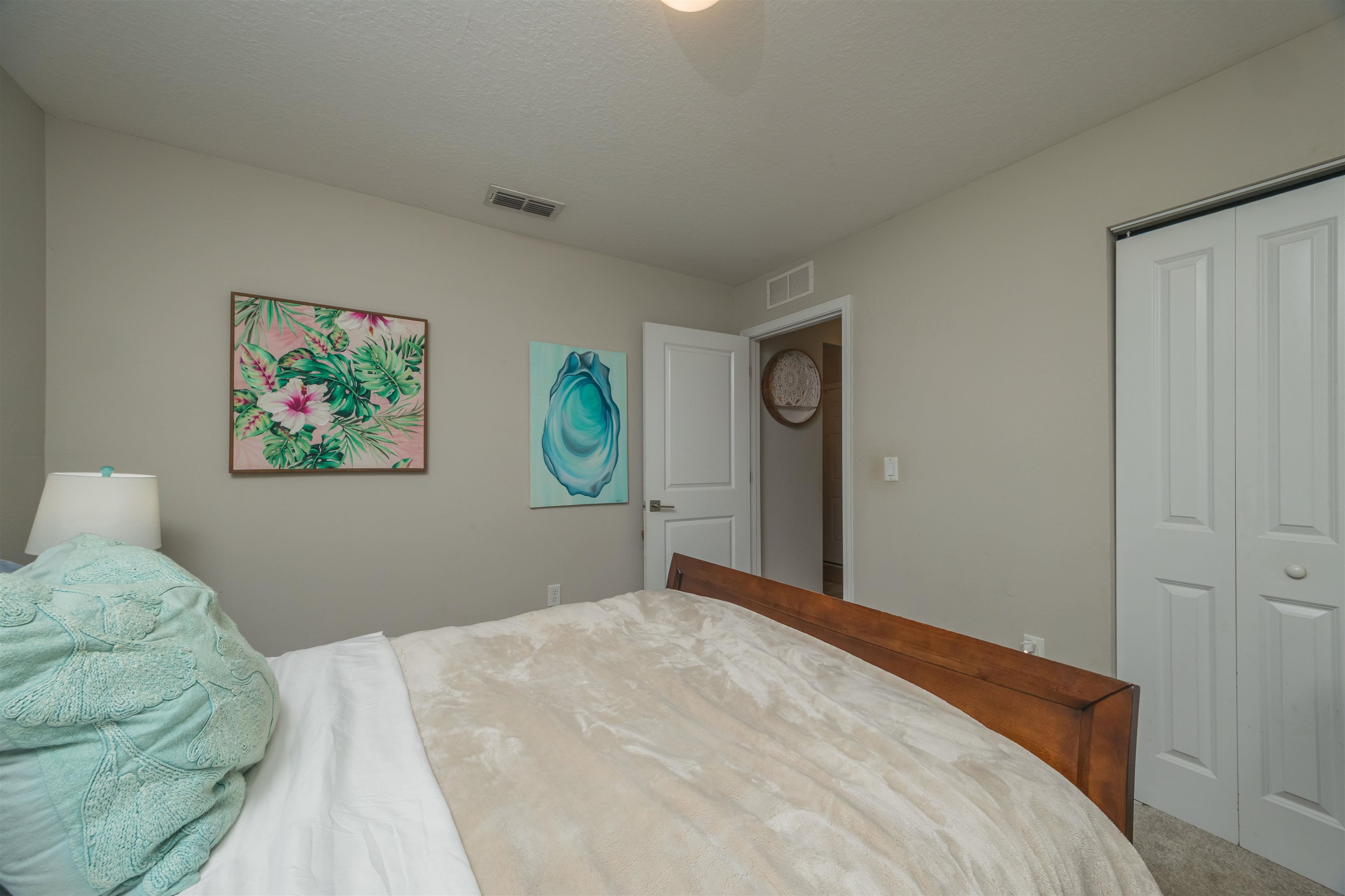151 Birdfield Court St. Augustine, FL 32092 - Photo 40 of 73 a bedroom with a bed and painting on the wall