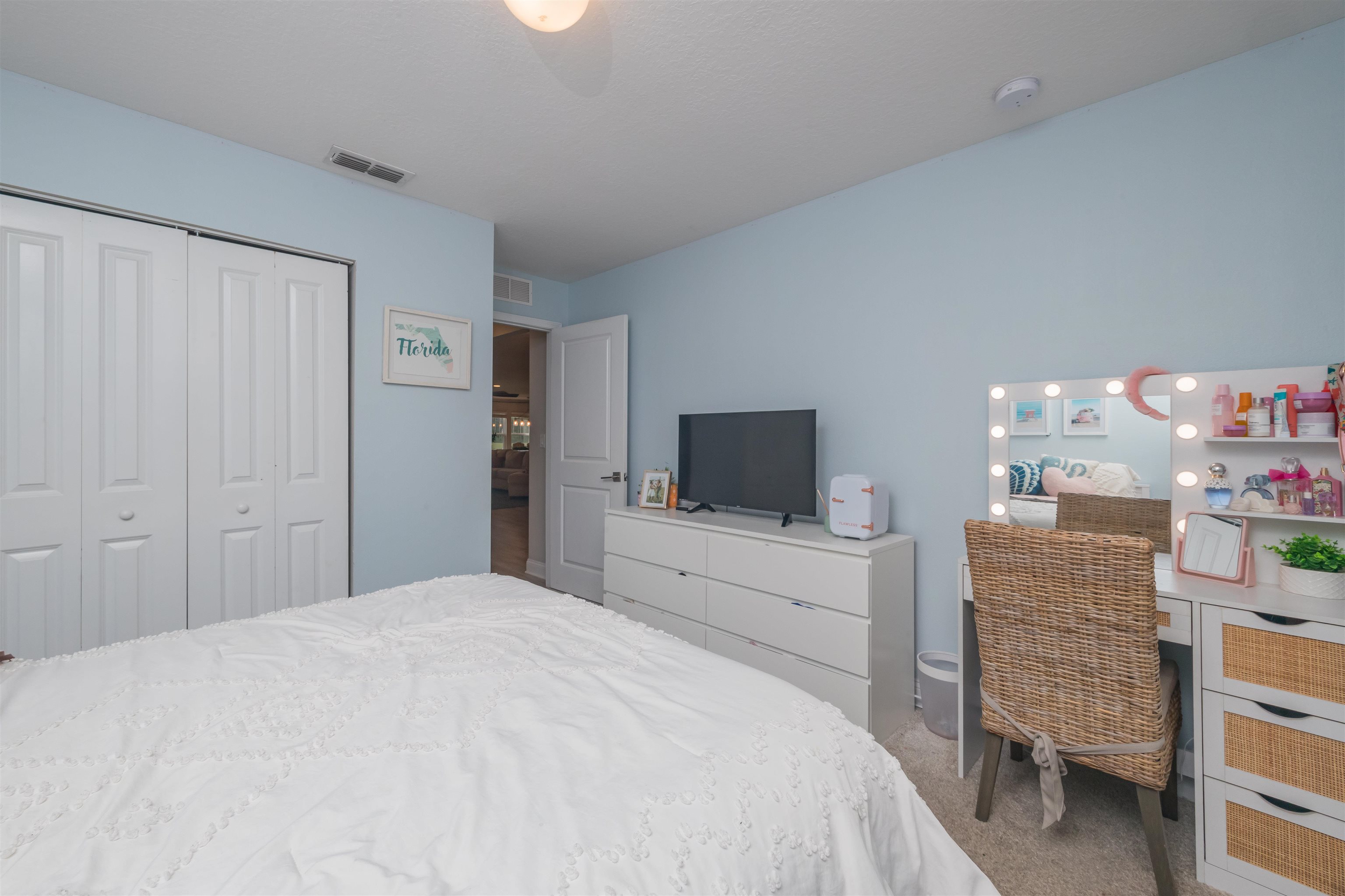 151 Birdfield Court St. Augustine, FL 32092 - Photo 44 of 73 a bedroom with a bed and a flat screen tv