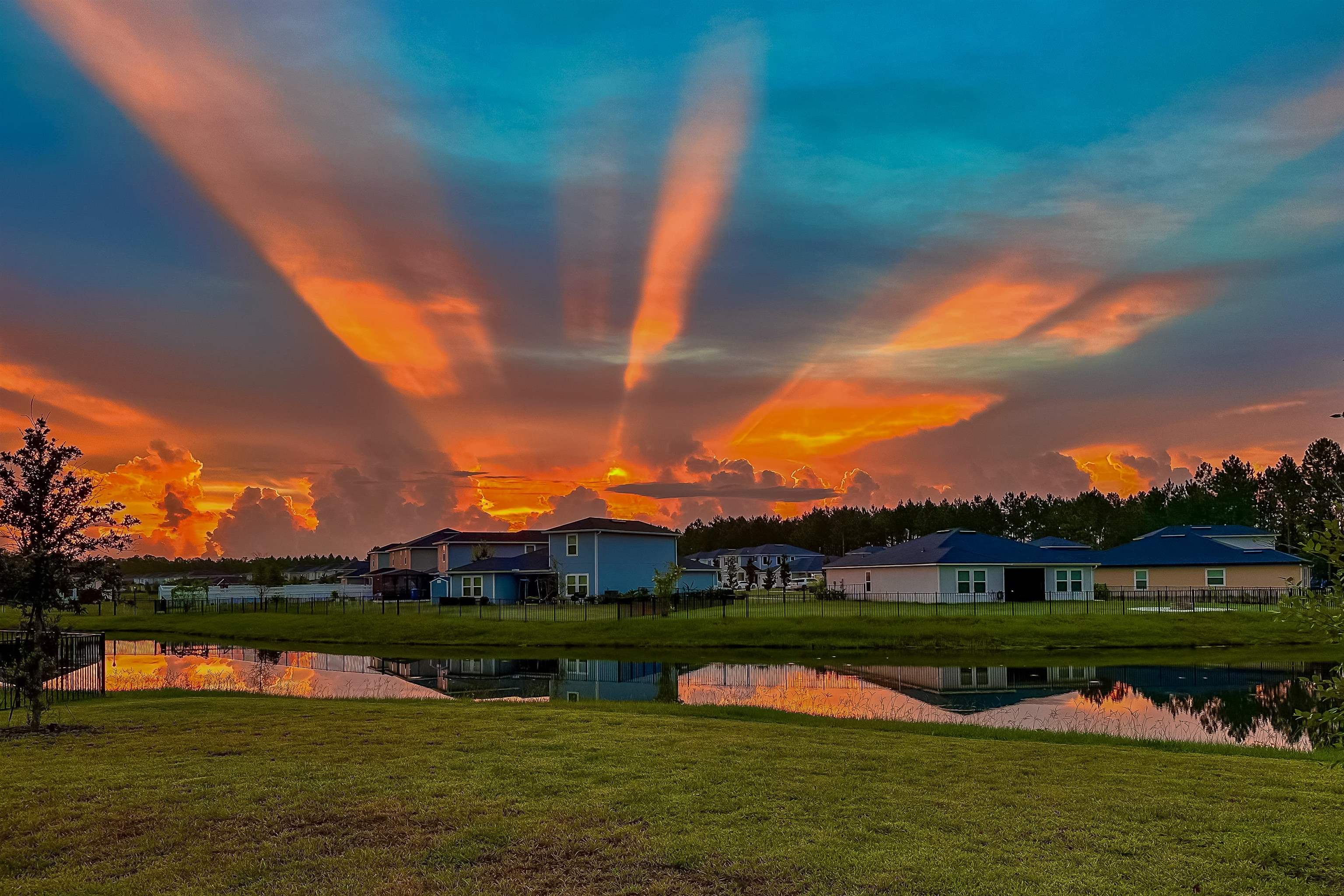 151 Birdfield Court St. Augustine, FL 32092 - Photo 72 of 73 a view of a lake with houses in the background