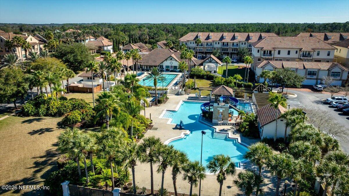 315 Via Castilla, Unit 204 St. Augustine, FL 32095 - Photo 11 of 18 an aerial view of a houses with a yard and lake view
