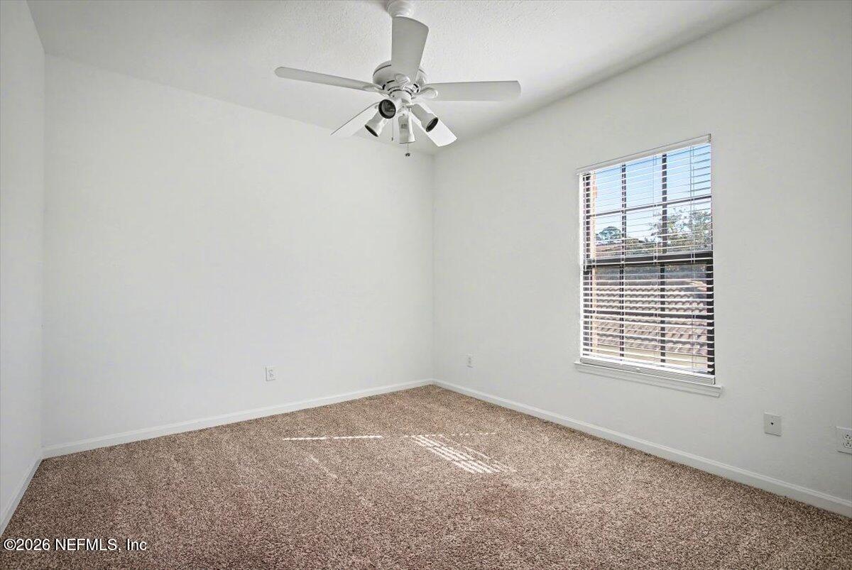 315 Via Castilla, Unit 204 St. Augustine, FL 32095 - Photo 7 of 18 an empty room with a window