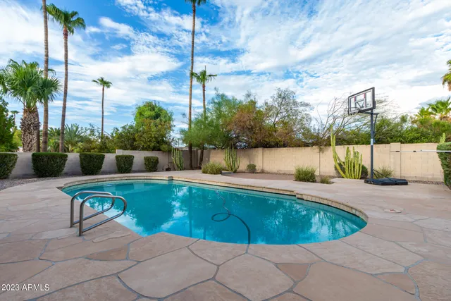 a view of a swimming pool with a patio