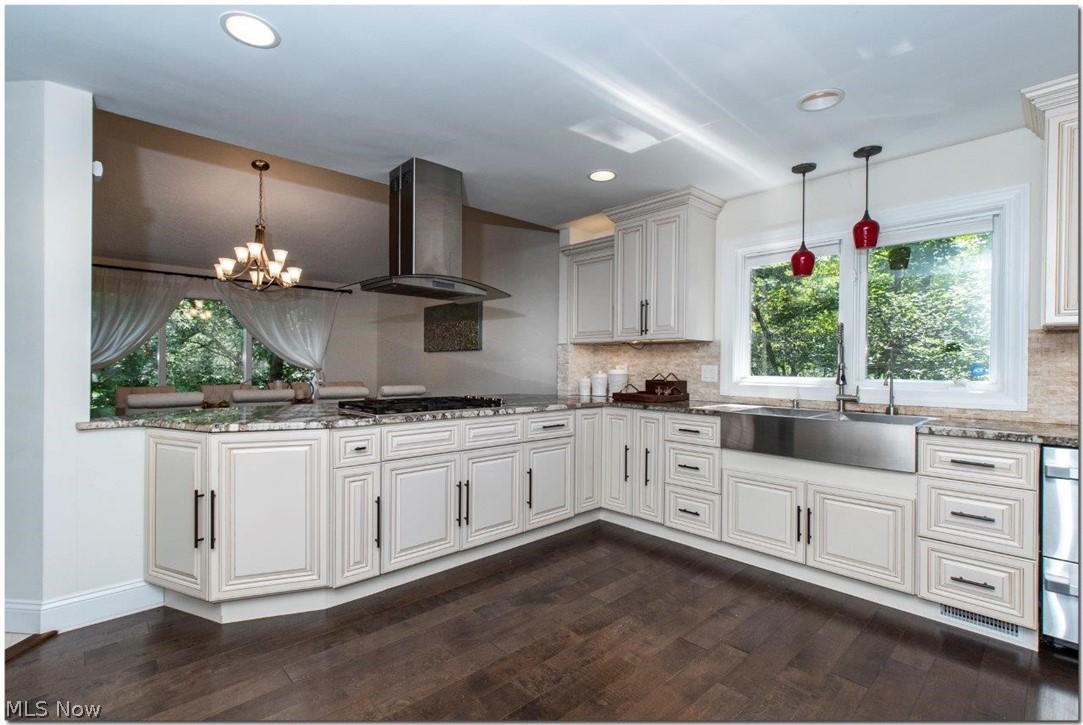 3200 Lander Road Pepper Pike, OH 44124 - Photo 10 of 35 The gourmet kitchen comes equipped with an abundance of cabinet space, center island, and high-end stainless steel appliances including a counter top range and double ovens.
Sliders allow access to a sizable back deck