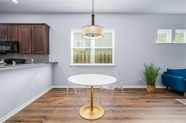 a dining room with furniture and window