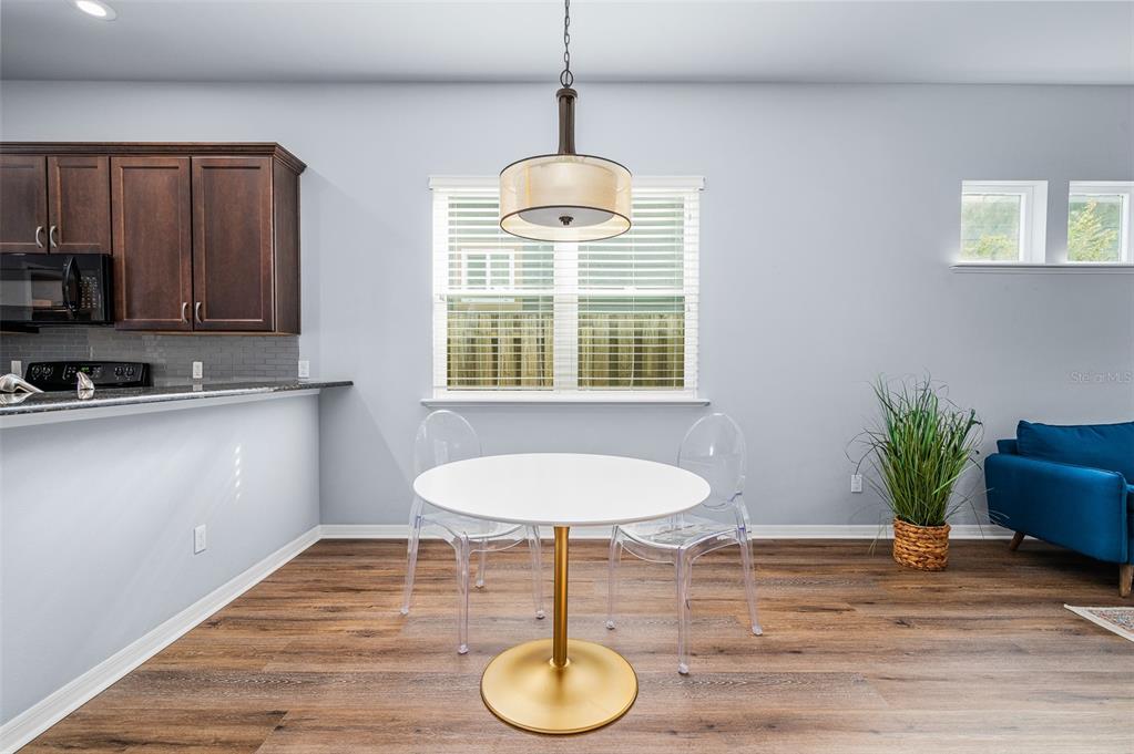 7891 Southwest 82nd Drive Gainesville, FL 32608 - Photo 12 of 38 a dining room with furniture and window
