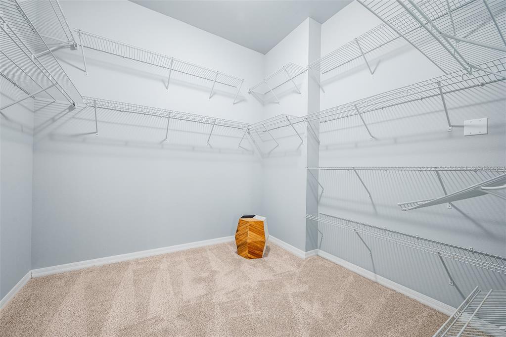 7891 Southwest 82nd Drive Gainesville, FL 32608 - Photo 16 of 38 a view of a room with racks on the wall