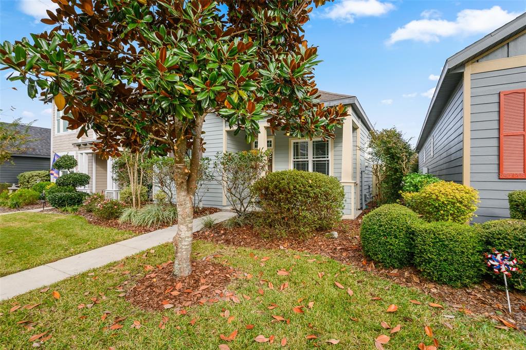 7891 Southwest 82nd Drive Gainesville, FL 32608 - Photo 29 of 38 a front view of a house with garden